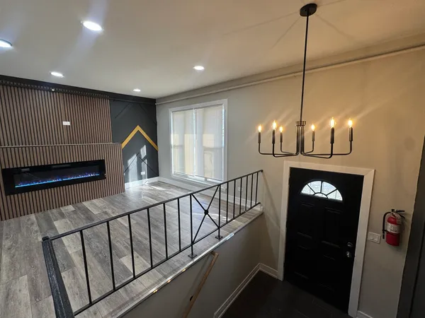 a view of hall way with furniture