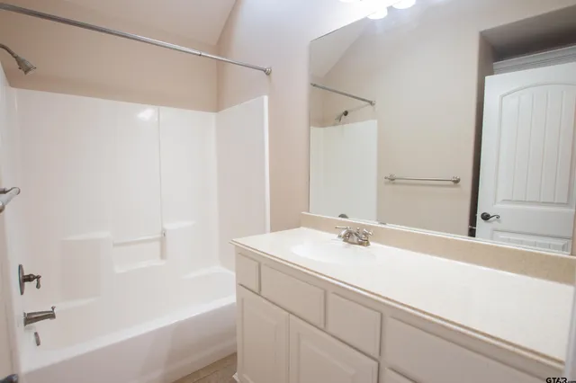 a bathroom with a sink and a bathtub