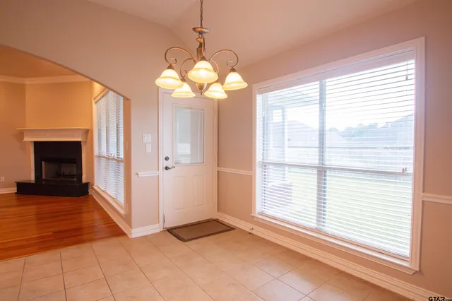 a view of a windows and chandelier in a room