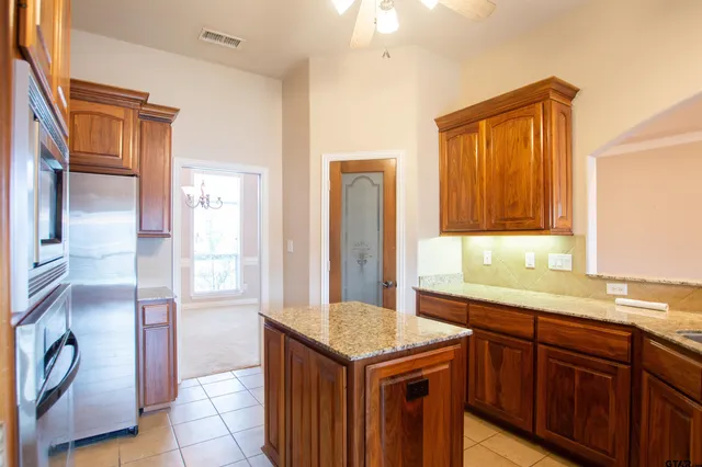 a bathroom with a sink a vanity and a mirror