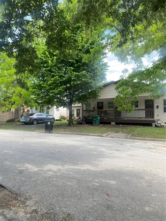 a view of street with parked cars