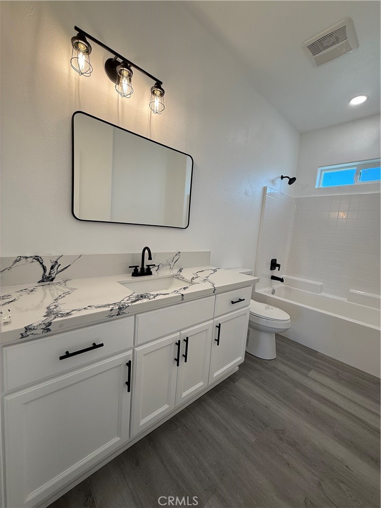 2115 Seville Place Pinon Hills, CA 92372 - Photo 23 of 31 a bathroom with a double vanity sink and a mirror