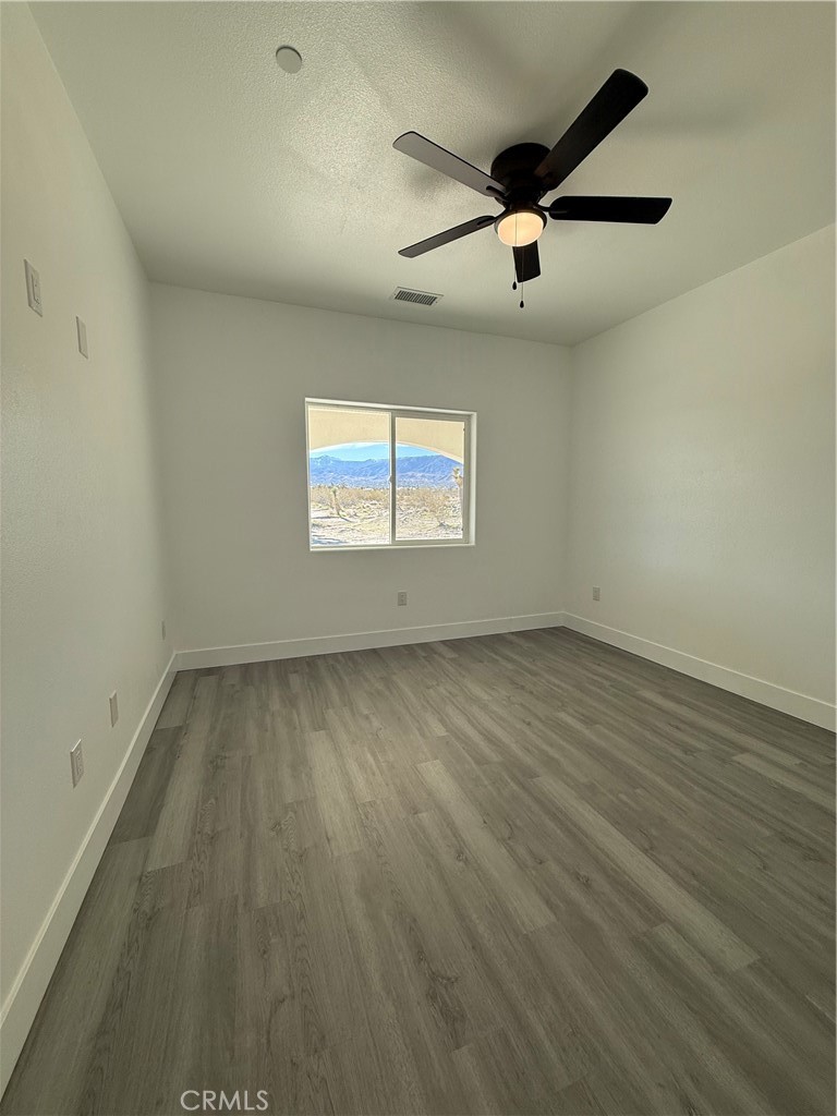 2115 Seville Place Pinon Hills, CA 92372 - Photo 24 of 31 an empty room with a window