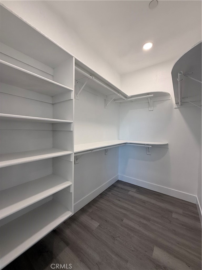2115 Seville Place Pinon Hills, CA 92372 - Photo 28 of 31 a view of walk in closet with empty racks
