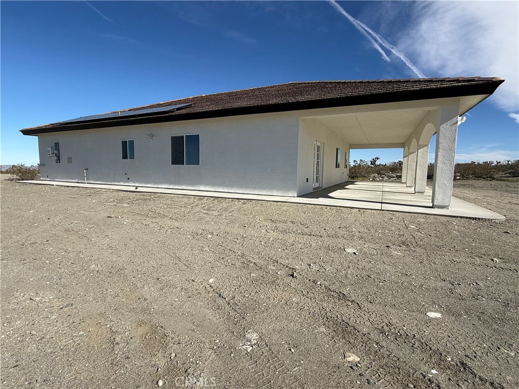 2115 Seville Place Pinon Hills, CA 92372 - Photo 6 of 31 a front view of a house with a yard