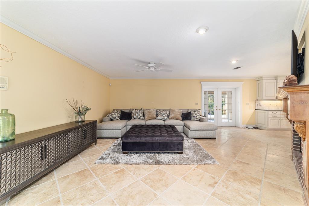 9080 Southwest 19th Avenue Road Ocala, FL 34476 - Photo 11 of 100 a living room with furniture fireplace and a flat screen tv