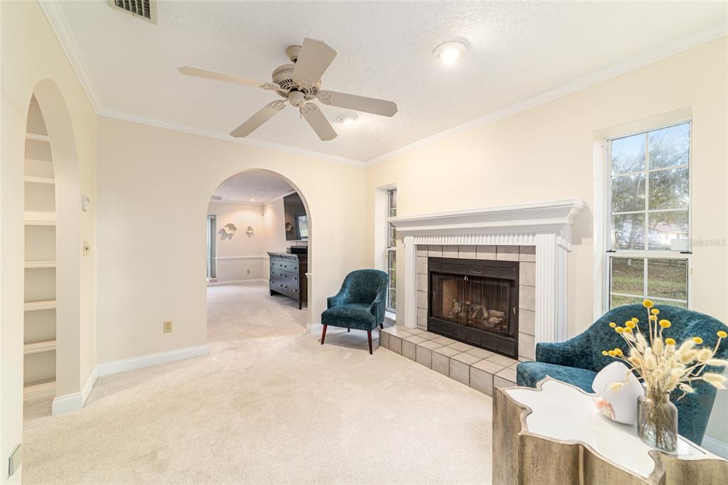 9080 Southwest 19th Avenue Road Ocala, FL 34476 - Photo 17 of 100 a living room with furniture and a fireplace