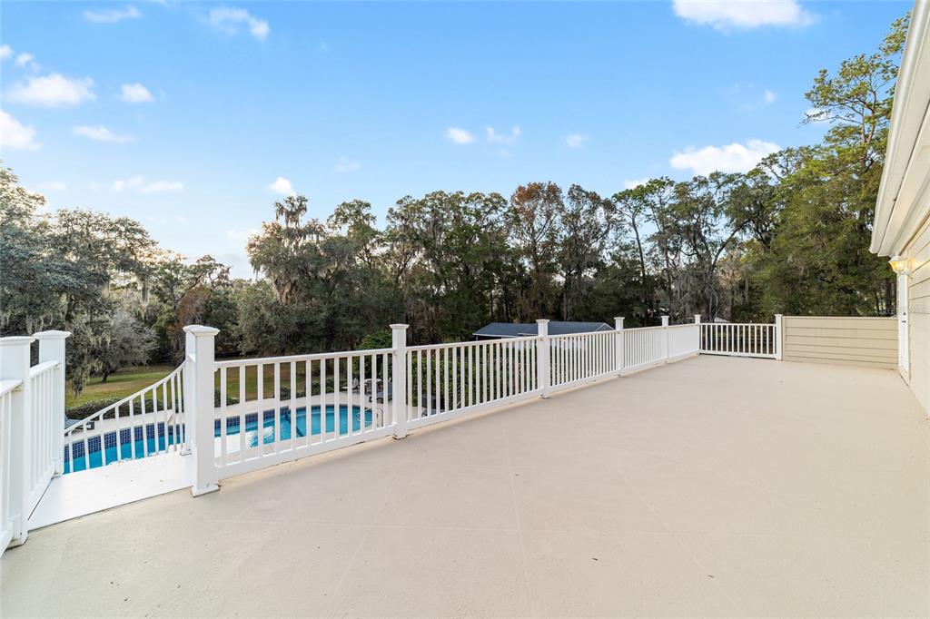 9080 Southwest 19th Avenue Road Ocala, FL 34476 - Photo 25 of 100 a view of a balcony with trees