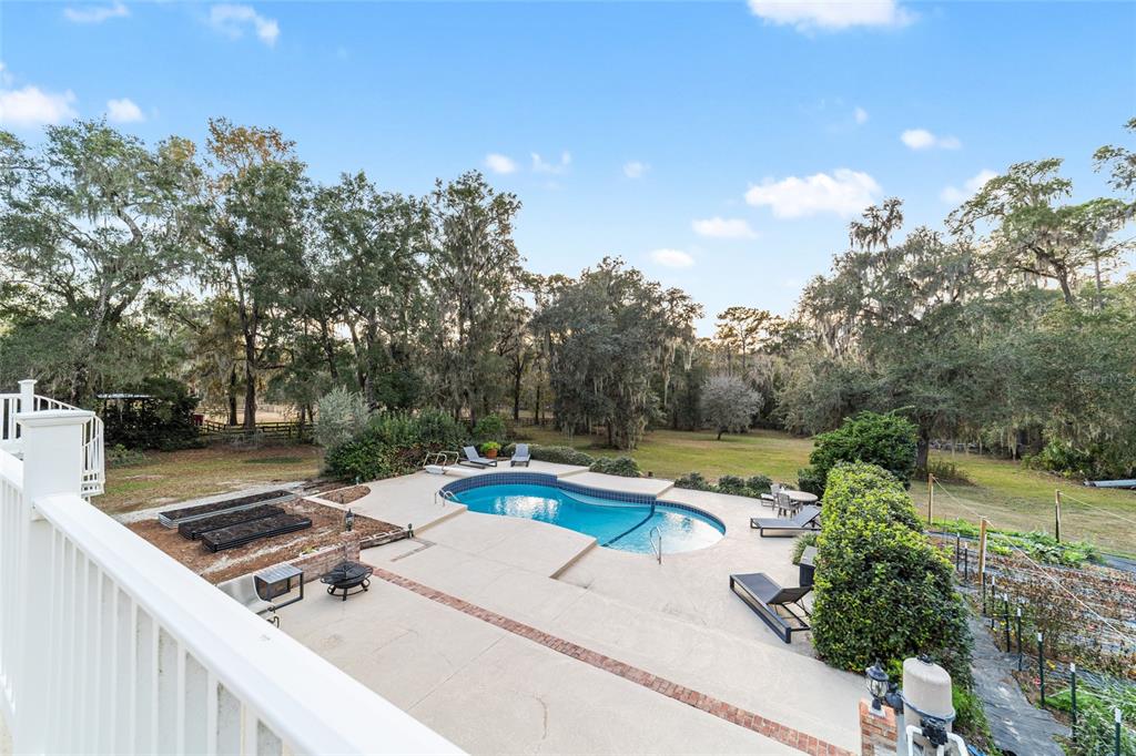9080 Southwest 19th Avenue Road Ocala, FL 34476 - Photo 26 of 100 a view of a swimming pool with a patio