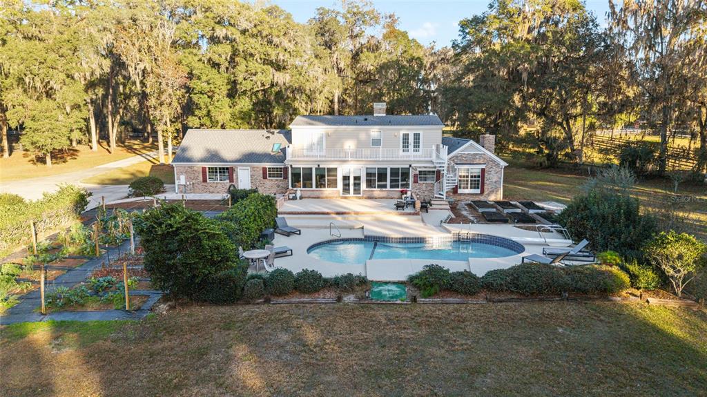 9080 Southwest 19th Avenue Road Ocala, FL 34476 - Photo 61 of 100 an aerial view of a house with a yard and lake view
