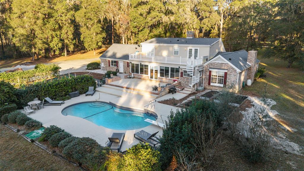 9080 Southwest 19th Avenue Road Ocala, FL 34476 - Photo 87 of 100 an aerial view of a house with yard swimming pool and outdoor seating