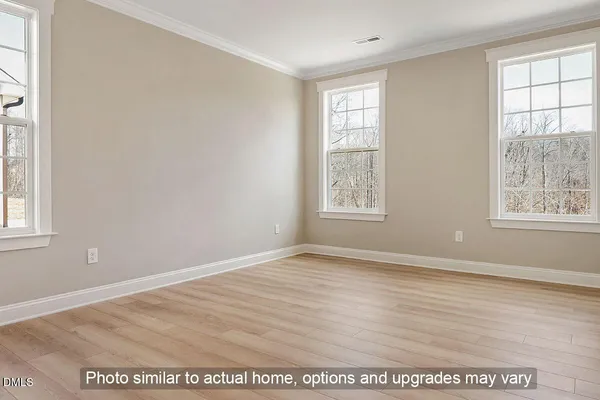 a spacious bathroom with a sink a mirror and a shower