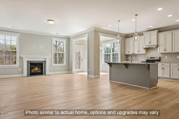 a view of kitchen with granite countertop cabinets with a fireplace