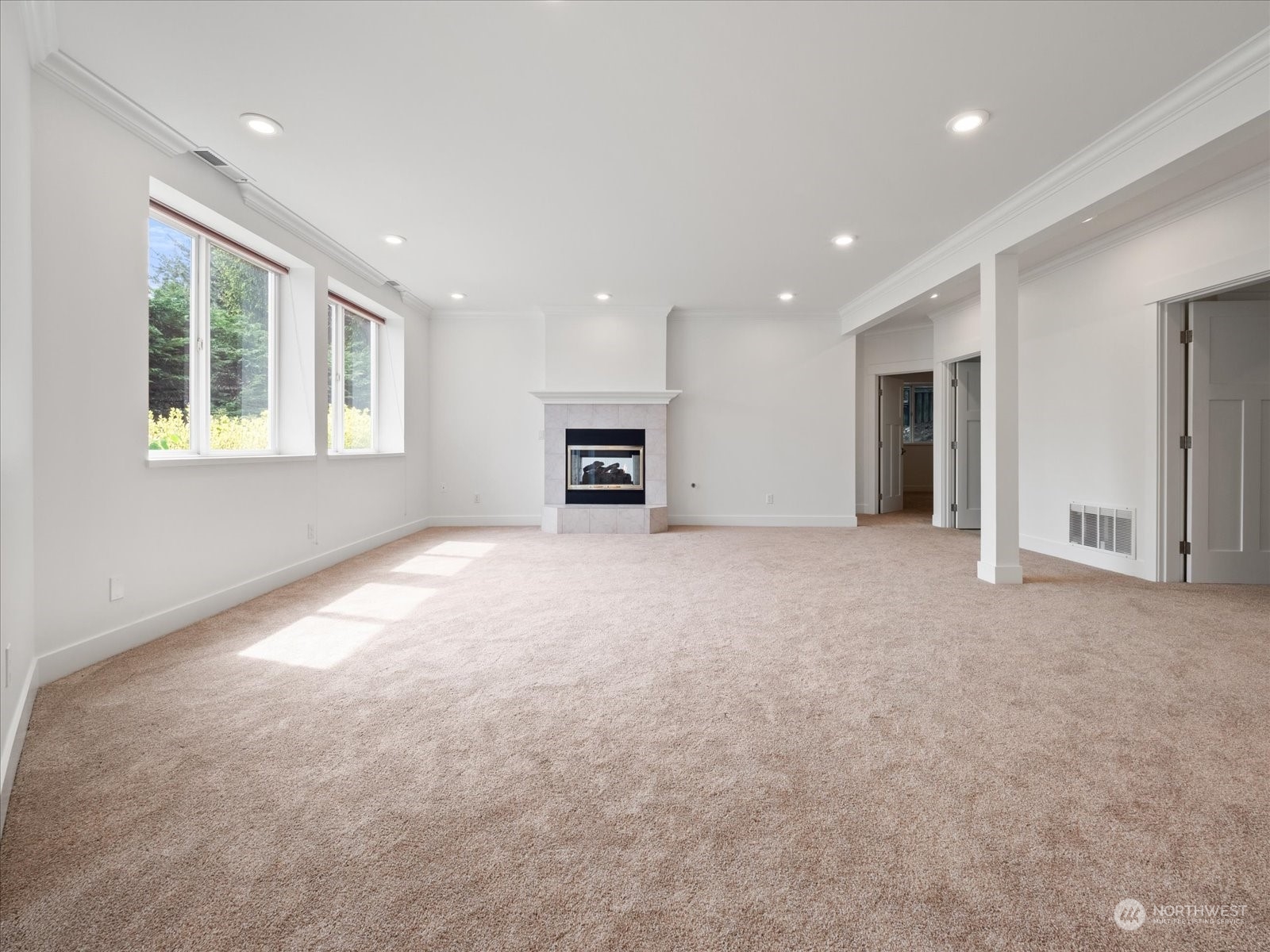 4191 Islander Way Anacortes, WA 98221 - Photo 15 of 40 an empty room with a window and a fireplace
