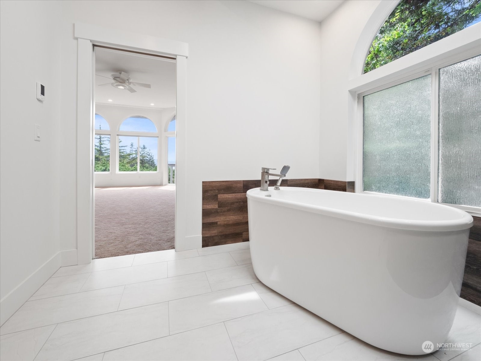 4191 Islander Way Anacortes, WA 98221 - Photo 16 of 40 a white bath tub sitting in a bathroom