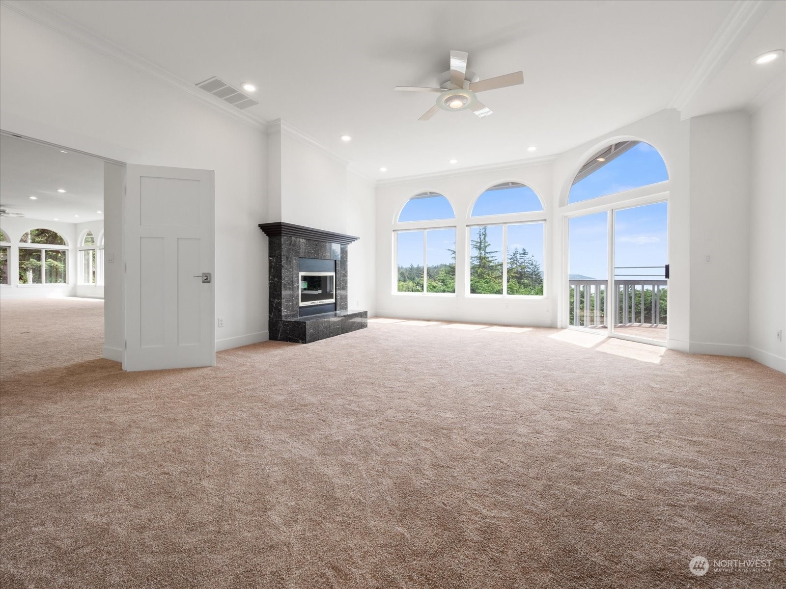 4191 Islander Way Anacortes, WA 98221 - Photo 19 of 40 a view of a kitchen with a sink and a fireplace