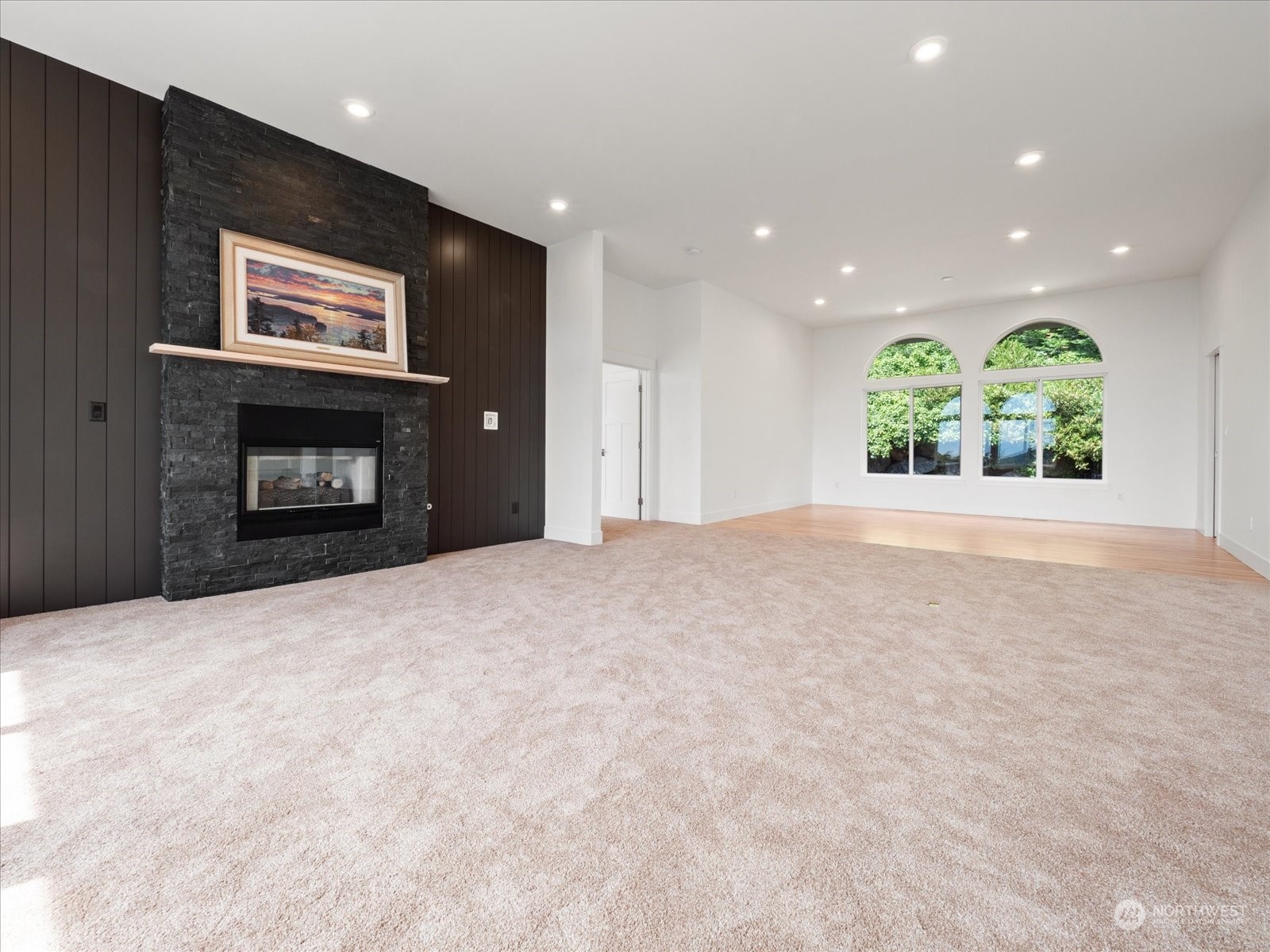 4191 Islander Way Anacortes, WA 98221 - Photo 20 of 40 a view of an empty room with a window and fireplace