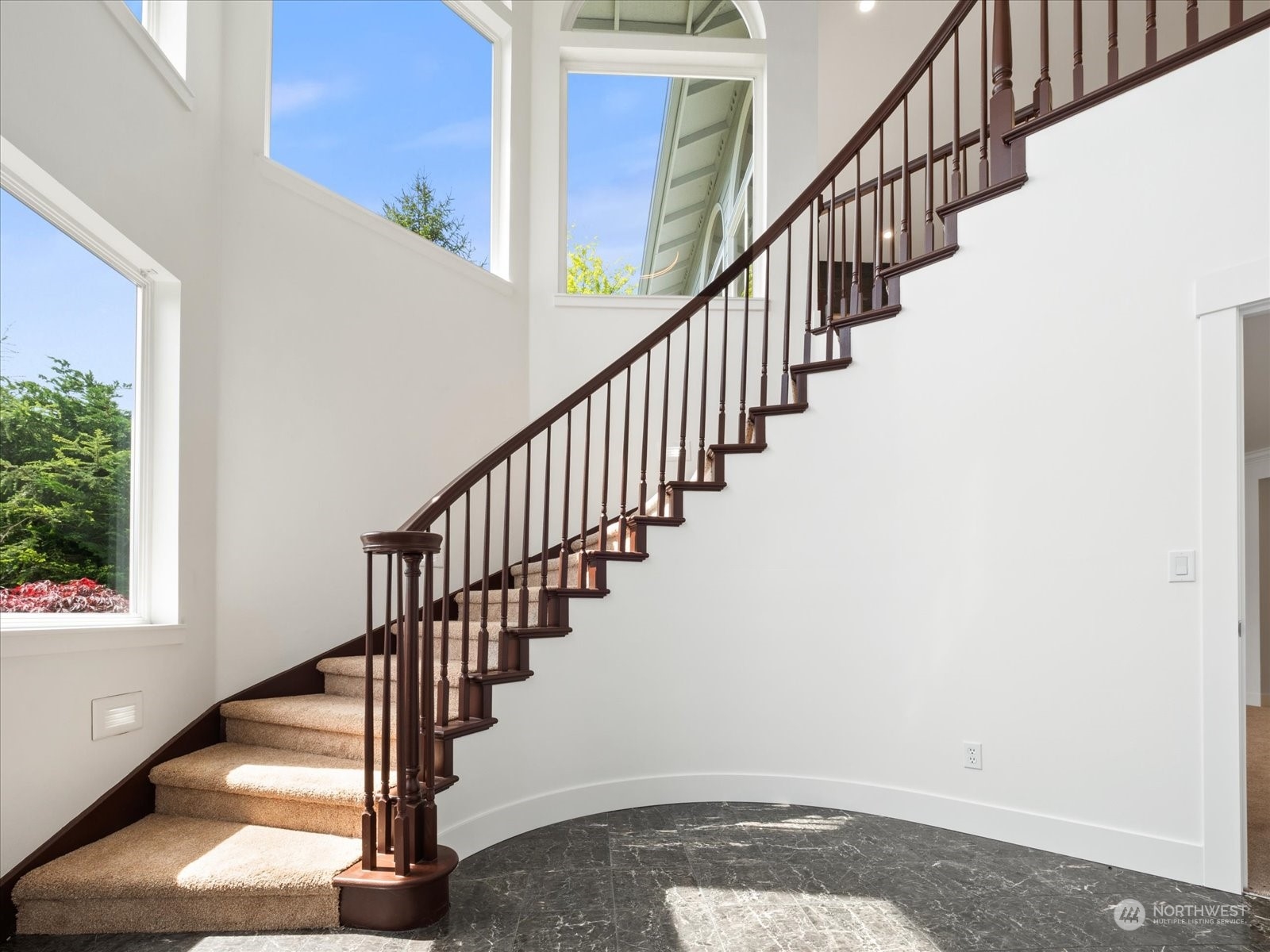 4191 Islander Way Anacortes, WA 98221 - Photo 2 of 40 a view of staircase with wooden floor and windows