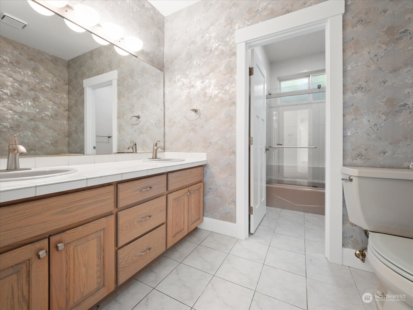 4191 Islander Way Anacortes, WA 98221 - Photo 24 of 40 a spacious bathroom with a double vanity sink and a mirror