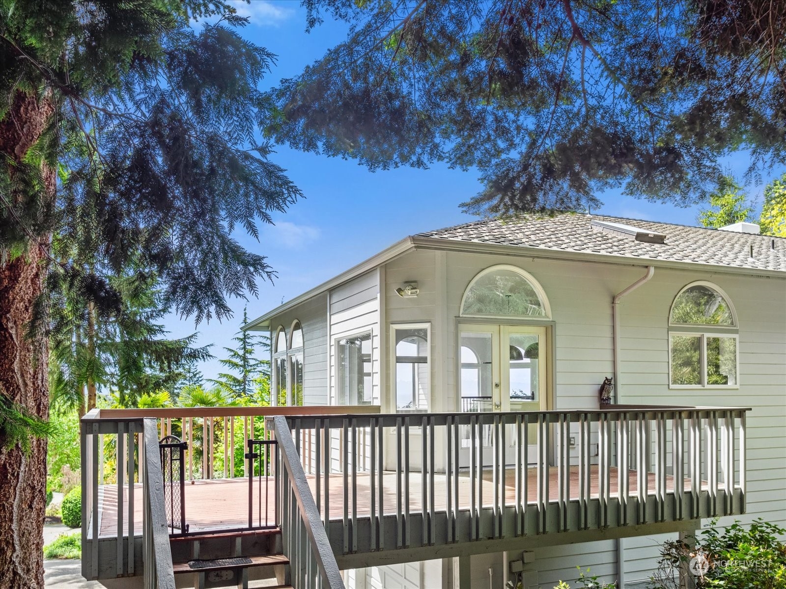 4191 Islander Way Anacortes, WA 98221 - Photo 29 of 40 a front view of a house with a garden