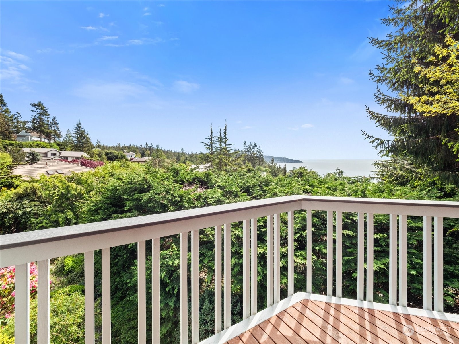 4191 Islander Way Anacortes, WA 98221 - Photo 30 of 40 a balcony with wooden floor and fence