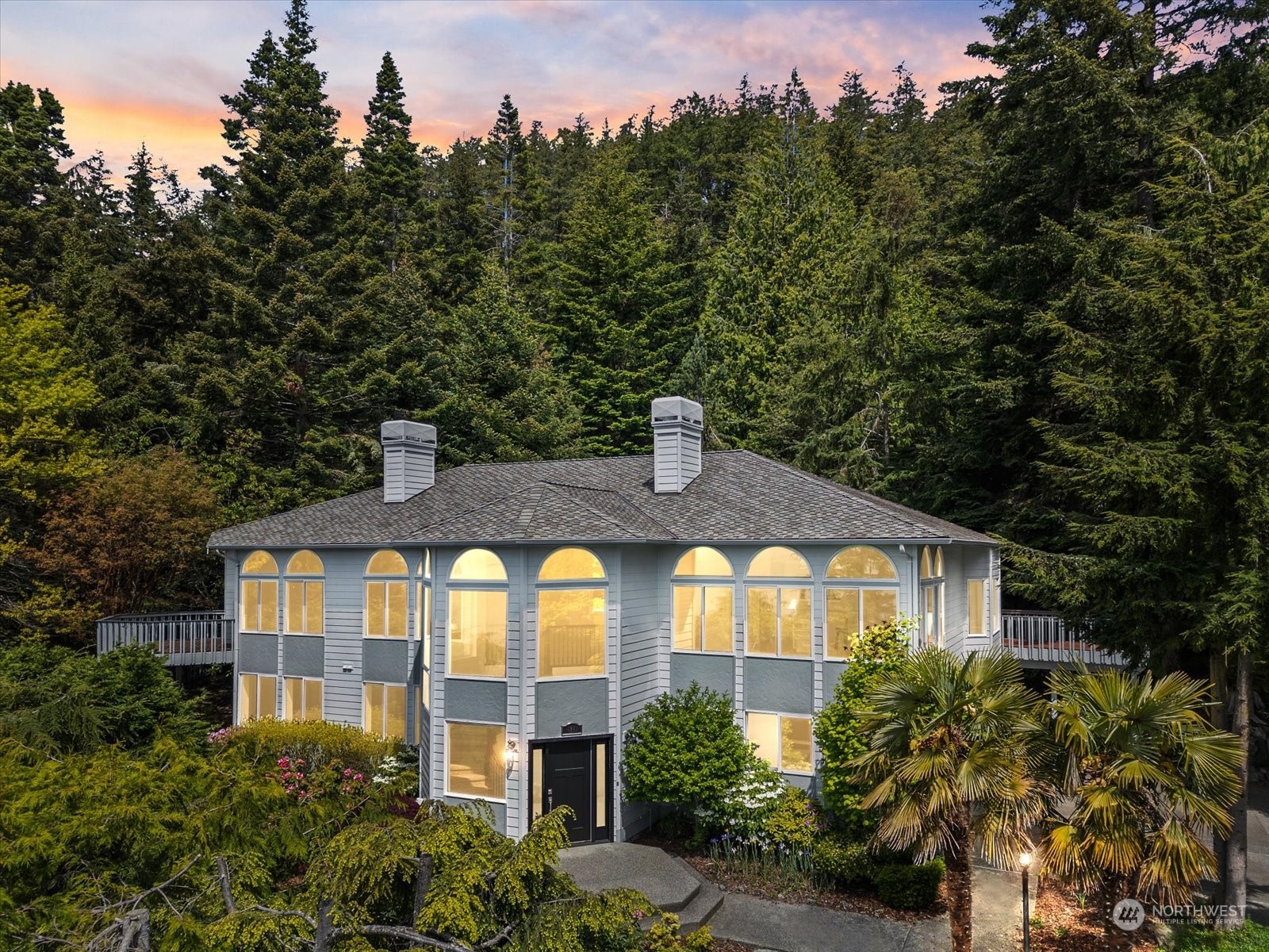 4191 Islander Way Anacortes, WA 98221 - Photo 39 of 40 a front view of a house with a yard and tree s