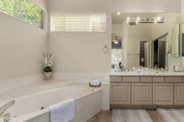 a bathroom with a bathtub and a sink