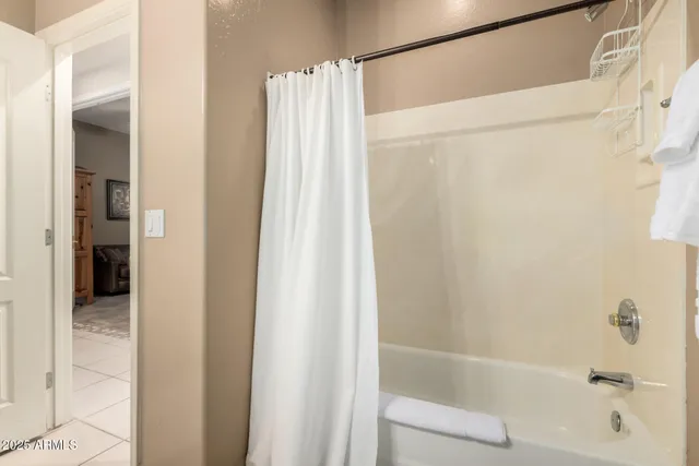 a bathroom with a shower and a tub