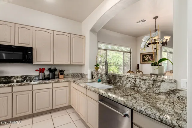 a kitchen with sink cabinets and window