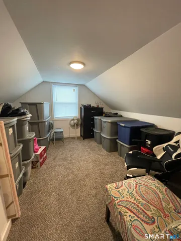 a bedroom with furniture and a utility room