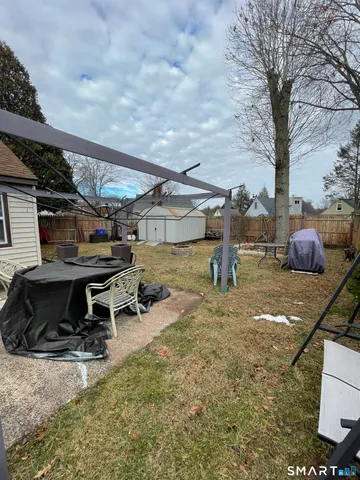 a view of a backyard with sitting area