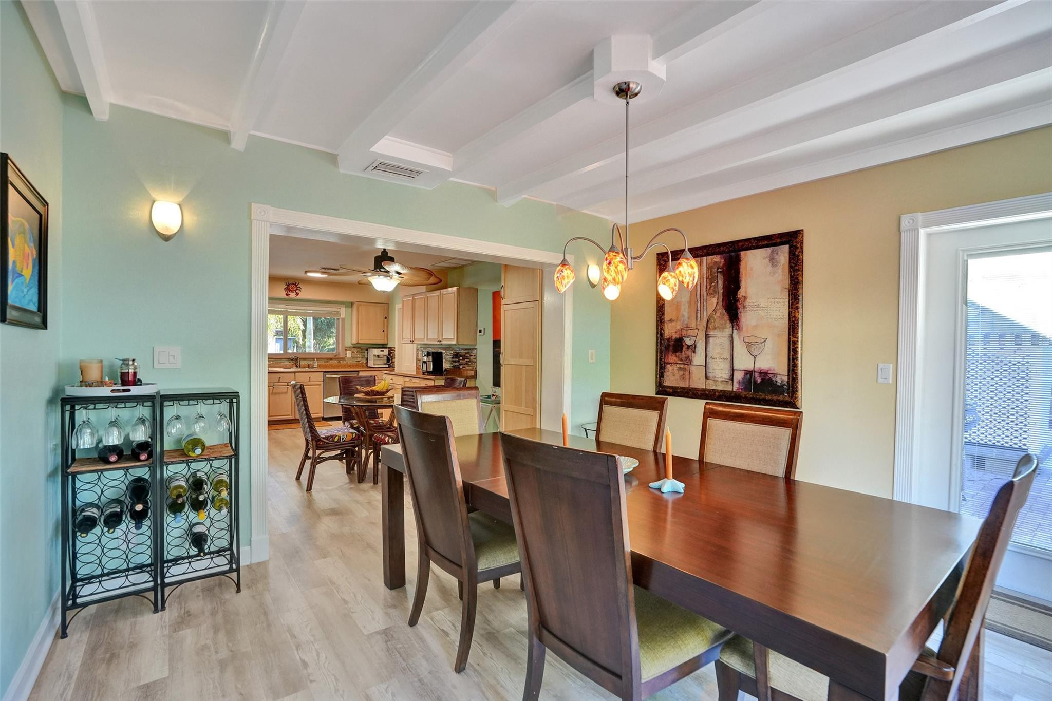 2585 Southeast 3rd Street Pompano Beach, FL 33062 - Photo 19 of 71 a view of a a dining room with furniture window and wooden floor