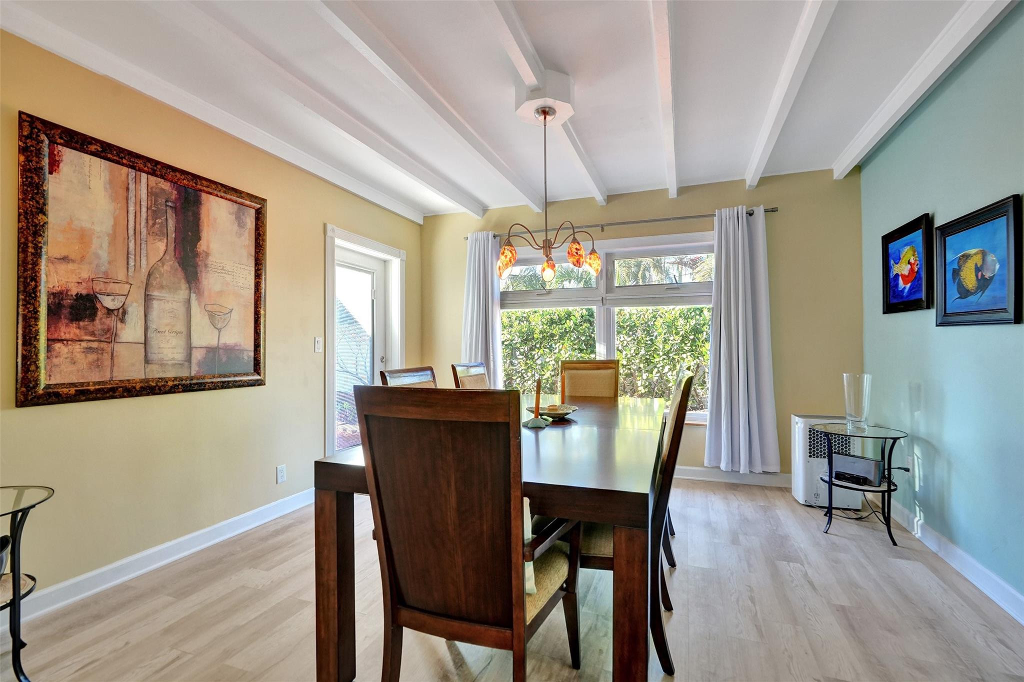 2585 Southeast 3rd Street Pompano Beach, FL 33062 - Photo 20 of 71 a view of a dining room with furniture large window and wooden floor