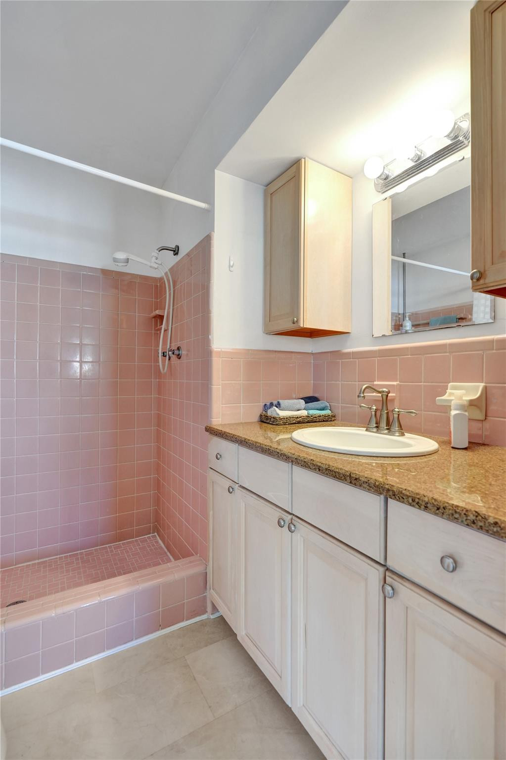 2585 Southeast 3rd Street Pompano Beach, FL 33062 - Photo 27 of 71 a bathroom with a granite countertop sink mirror bathtub and shower