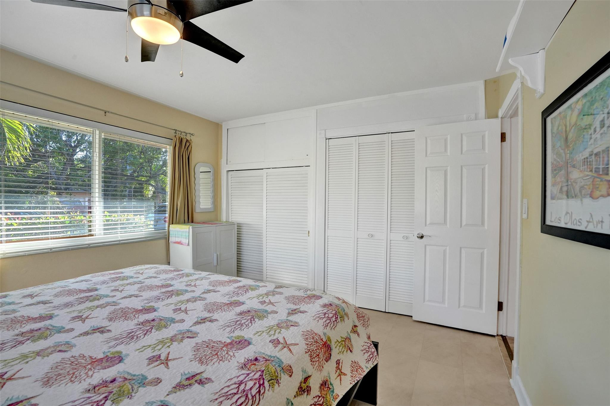 2585 Southeast 3rd Street Pompano Beach, FL 33062 - Photo 30 of 71 a bedroom with a large bed and a window