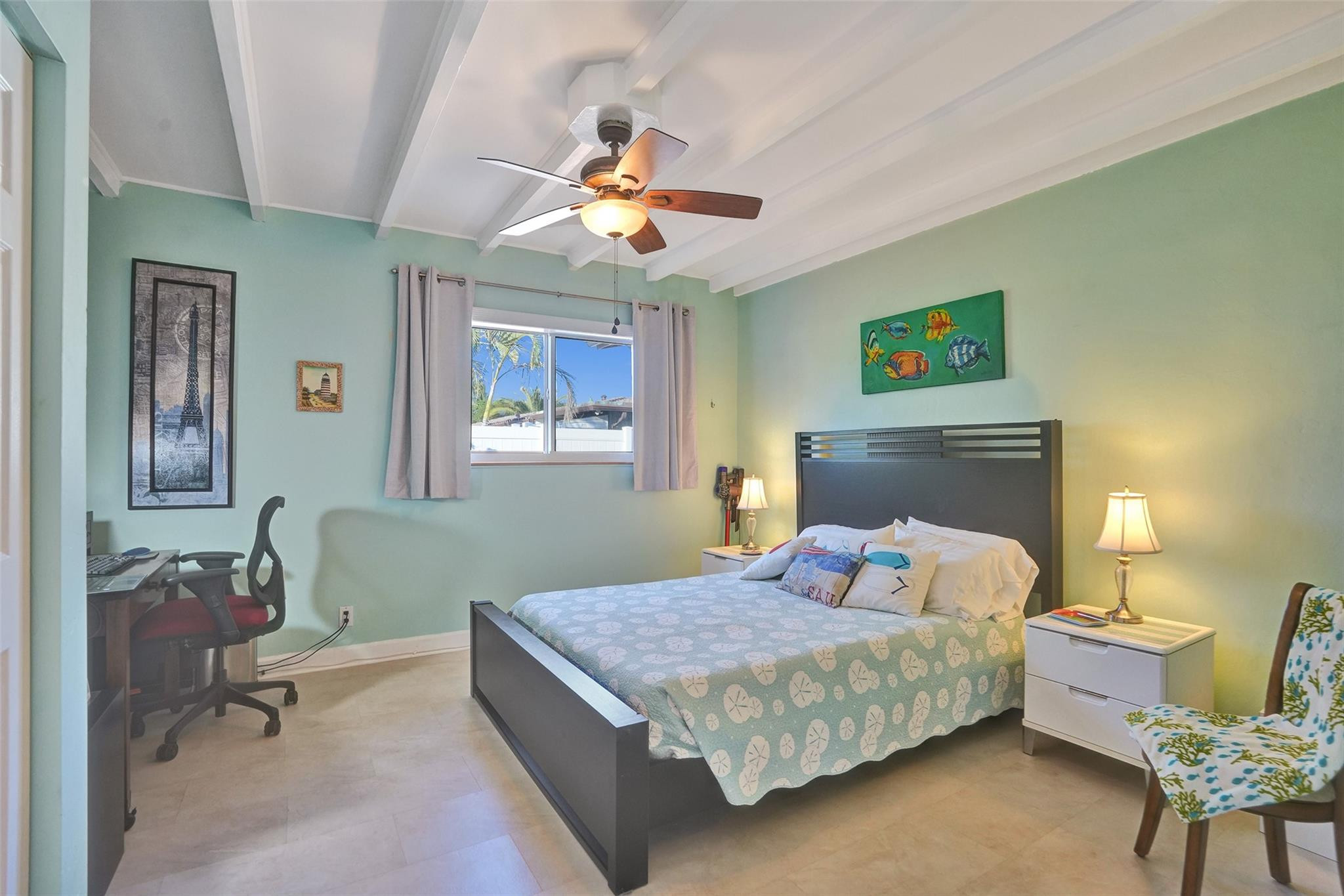 2585 Southeast 3rd Street Pompano Beach, FL 33062 - Photo 33 of 71 a bedroom with a bed and a chandelier