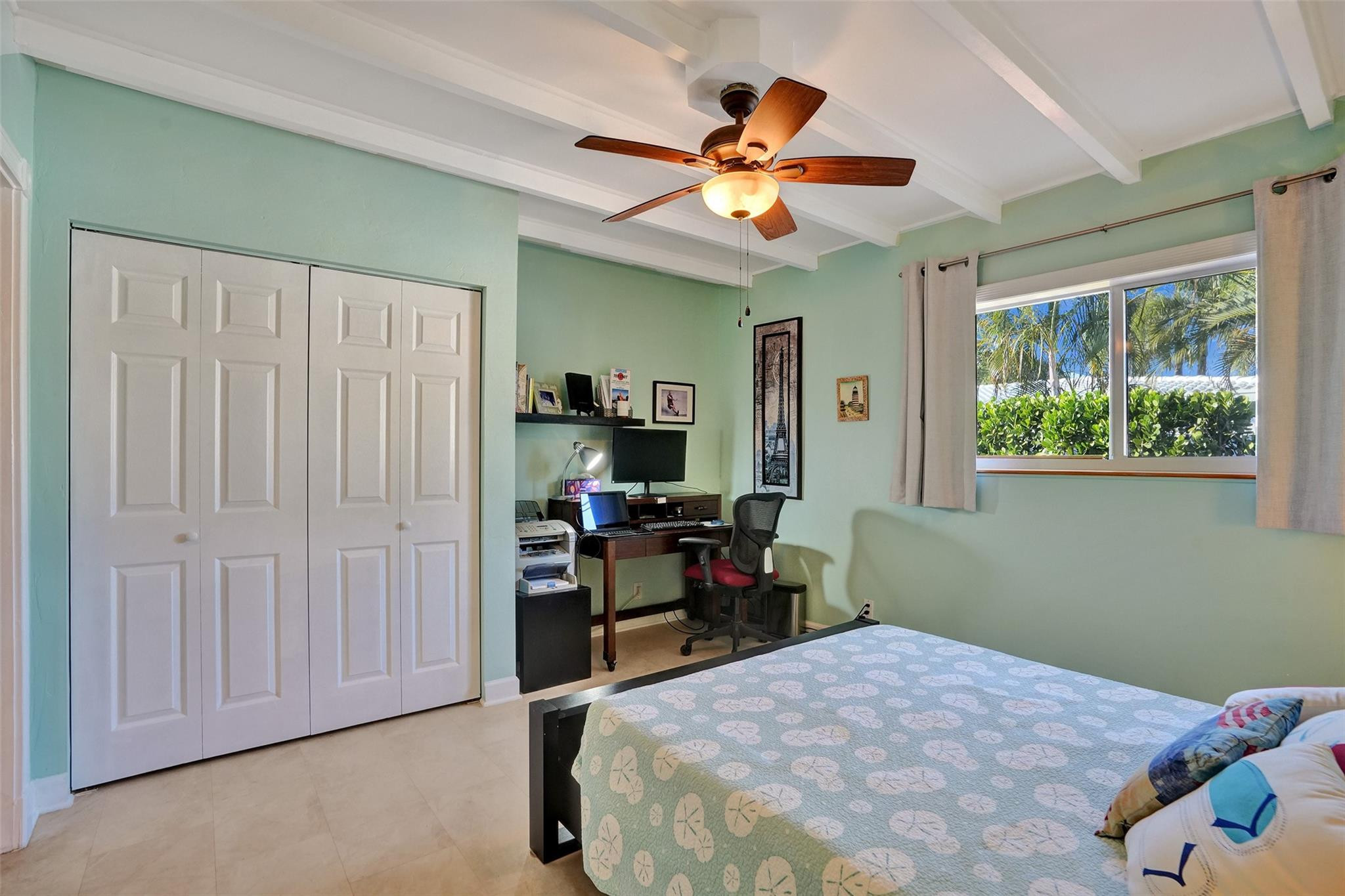 2585 Southeast 3rd Street Pompano Beach, FL 33062 - Photo 34 of 71 a bedroom with a bed and a chandelier