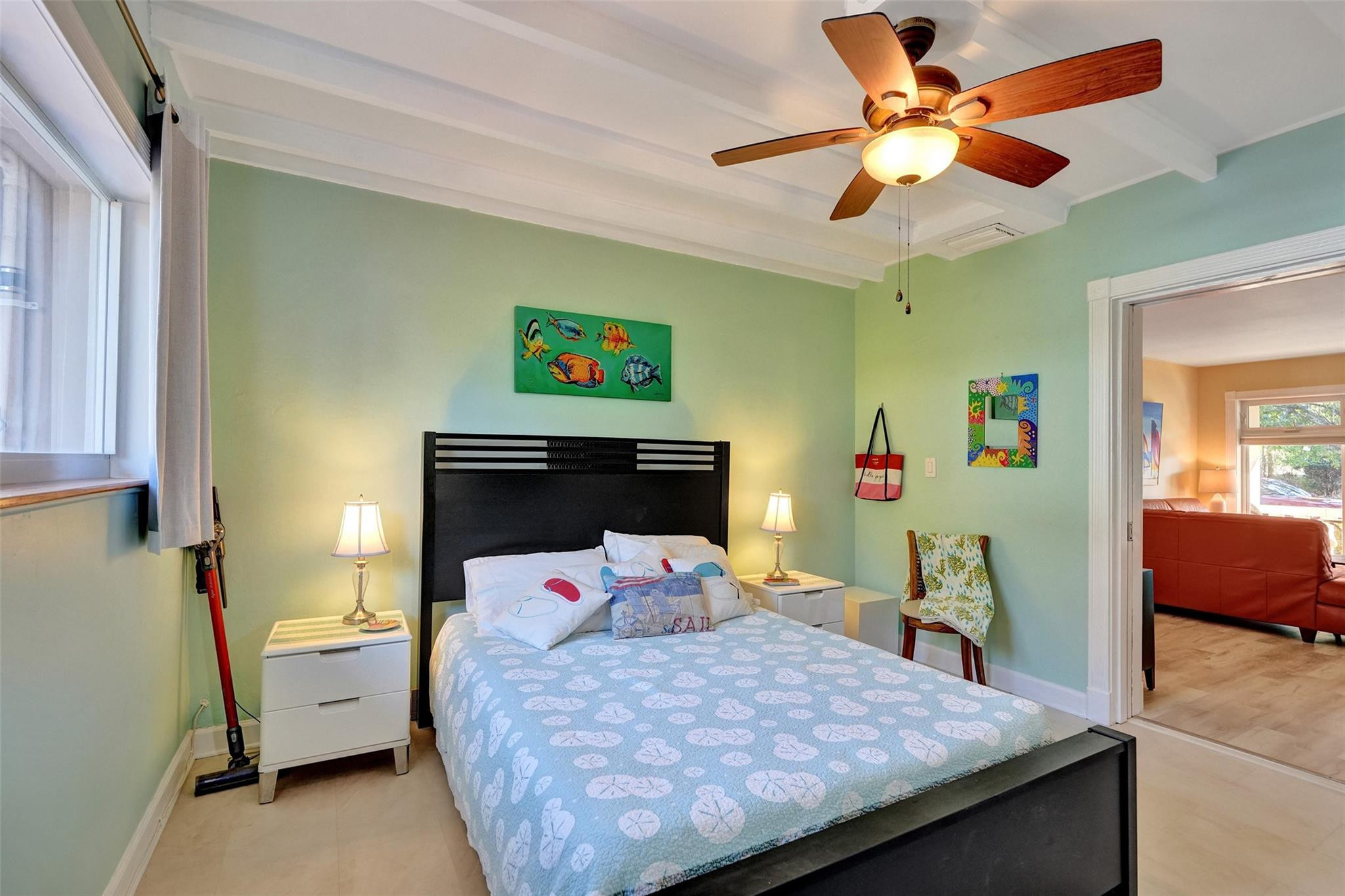 2585 Southeast 3rd Street Pompano Beach, FL 33062 - Photo 35 of 71 a bedroom with a bed and a chandelier