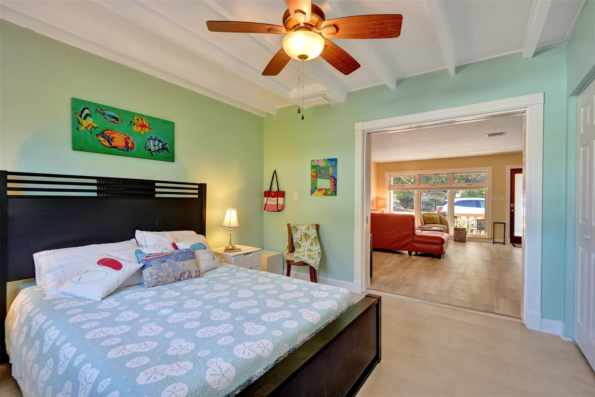 2585 Southeast 3rd Street Pompano Beach, FL 33062 - Photo 36 of 71 a bedroom with a bed and a chandelier