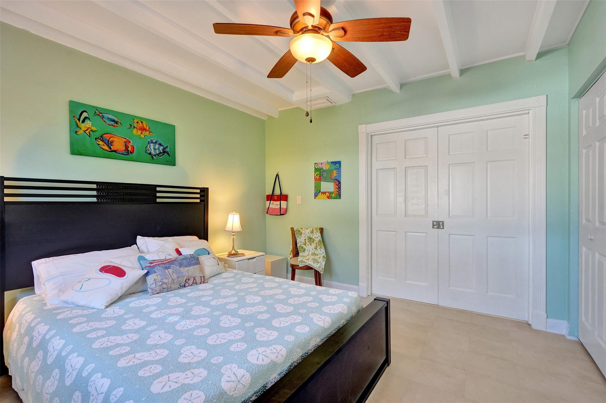 2585 Southeast 3rd Street Pompano Beach, FL 33062 - Photo 37 of 71 a bedroom with a bed and a chandelier