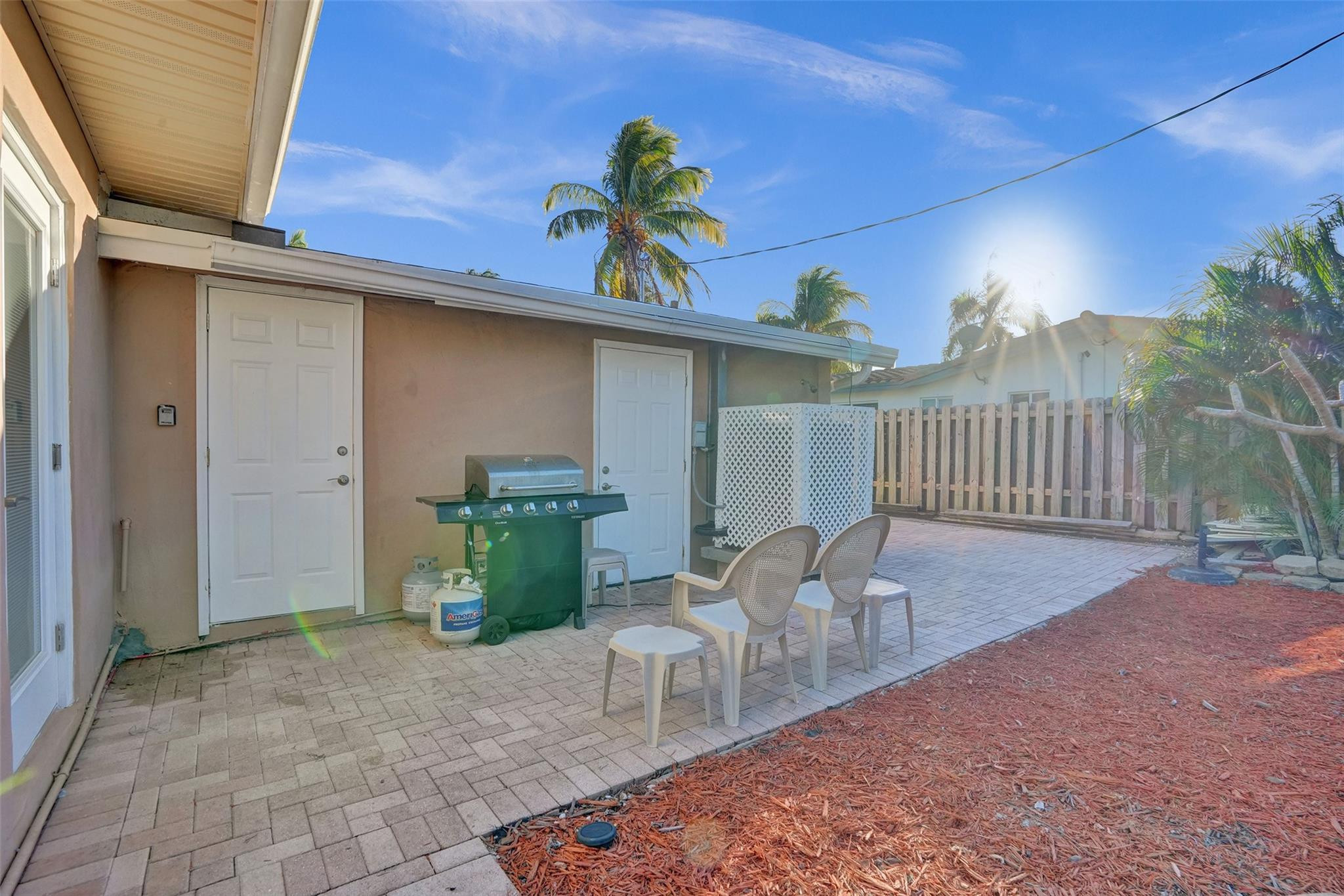 2585 Southeast 3rd Street Pompano Beach, FL 33062 - Photo 42 of 71 a view of a patio with a table and chairs