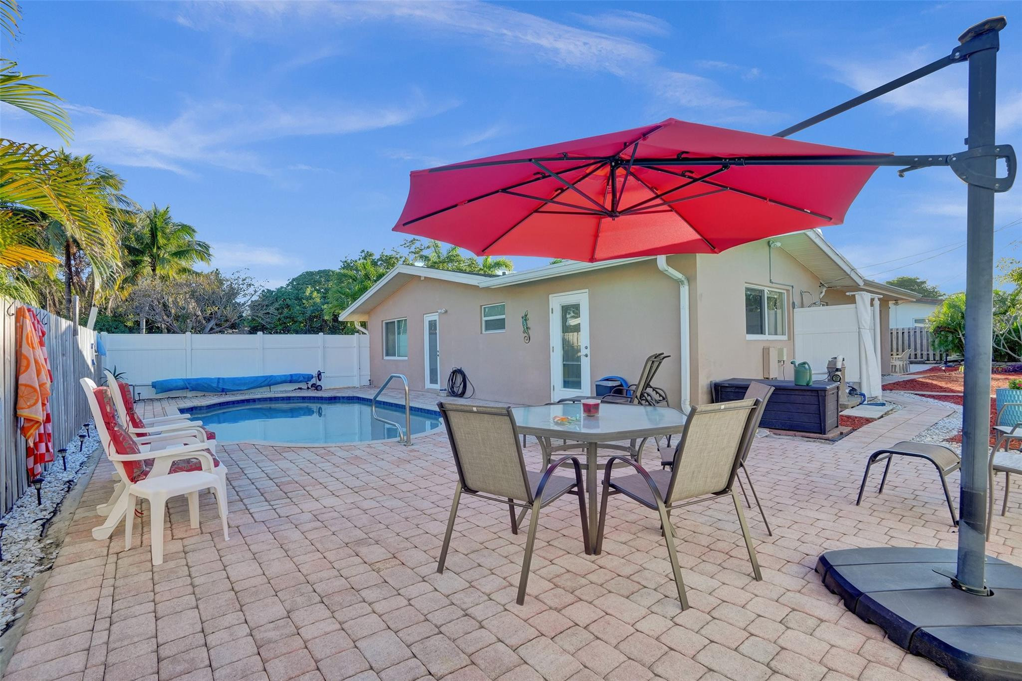 2585 Southeast 3rd Street Pompano Beach, FL 33062 - Photo 46 of 71 an outdoor space with furniture and umbrella