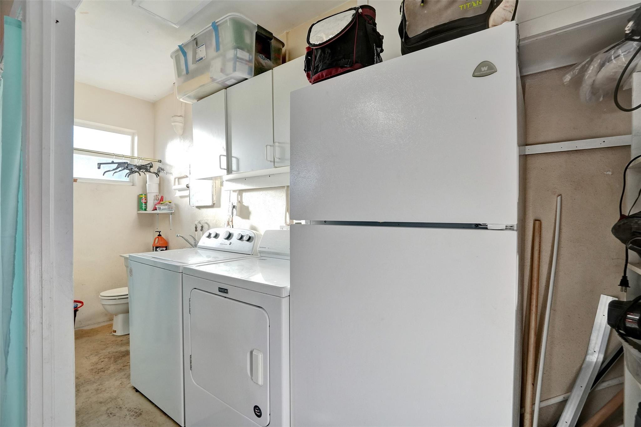 2585 Southeast 3rd Street Pompano Beach, FL 33062 - Photo 52 of 71 a kitchen with a refrigerator and a sink