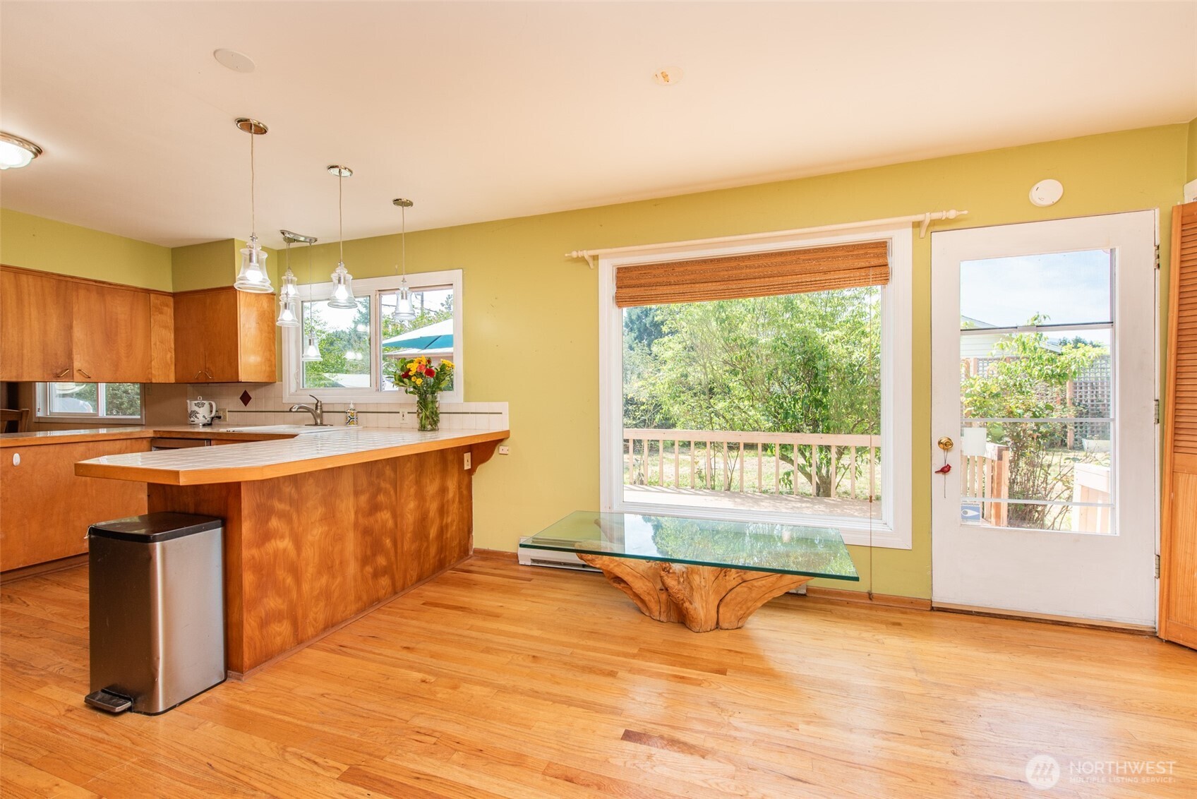 307 East Fir Street Sequim, WA 98382 - Photo 12 of 29 a view of a kitchen with wooden floor and a window