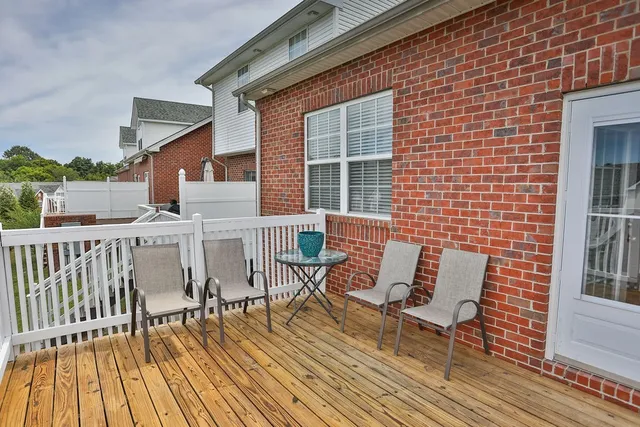 a view of a brick building with a bench
