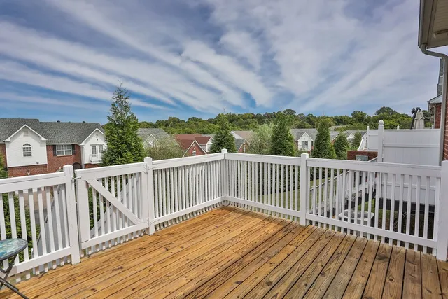 a view of balcony with wooden floor