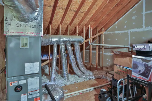a view of a livingroom with furniture and staircase