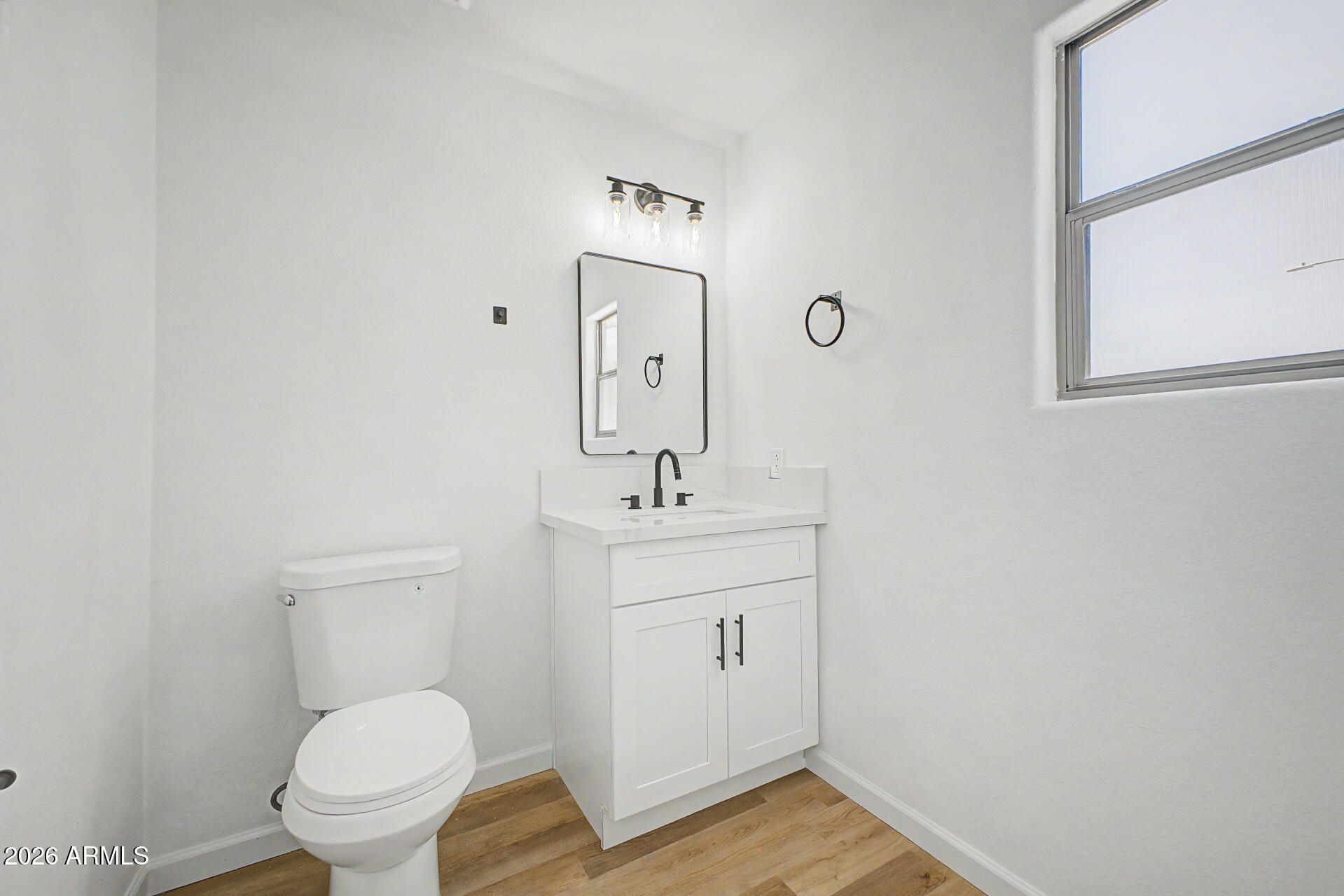 6452 West Ruth Avenue Glendale, AZ 85302 - Photo 16 of 35 a bathroom with a sink a toilet and mirror