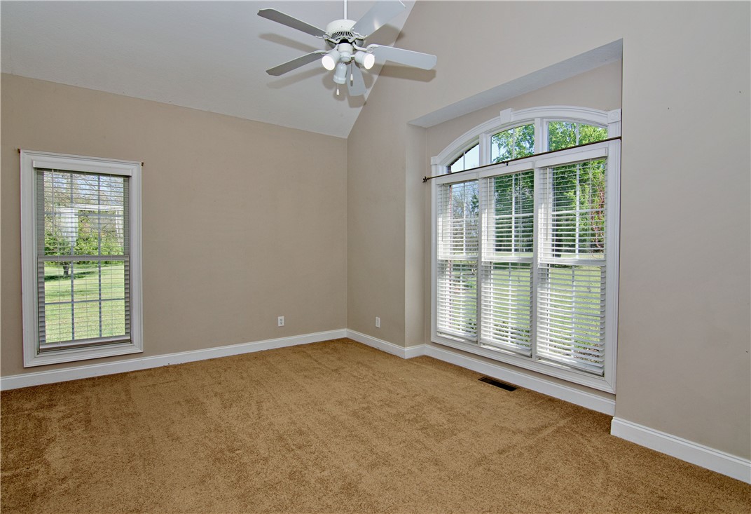 7893 Athens Road Carnesville, GA 30521 - Photo 22 of 50 This airy bedroom features vaulted ceilings and ample natural light, offering a tranquil retreat.