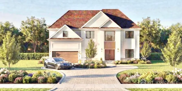 a front view of a house with a yard outdoor seating and covered with trees